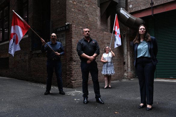 Troy Wright (centre) with legal counsel (right) Alison McRobert and CPSU delegates John Williams and Faith Dent after winning the case to overturn the pay cut for members.