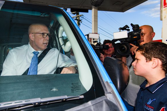 Then opposition leader Peter Dutton in April on his petrol station tour during the election campaign.