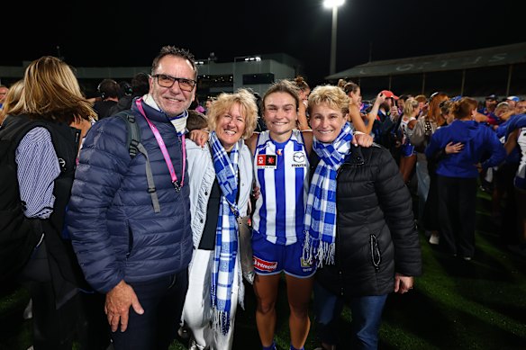 Kangaroos superstar Ash Riddell celebrates the moment with her family.