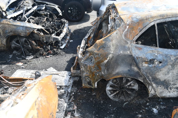 Firefighters were called to Sydney Airport where flames had engulfed five cars.