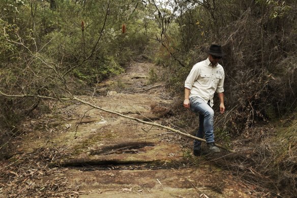 Duncan Rayner, a UNSW researcher, at a dried-up creek within the Metropolitan Special Area over the Dendrobium coal mine.