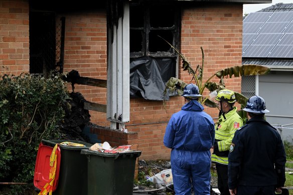 Emergency services personnel at the house on Monday morning.