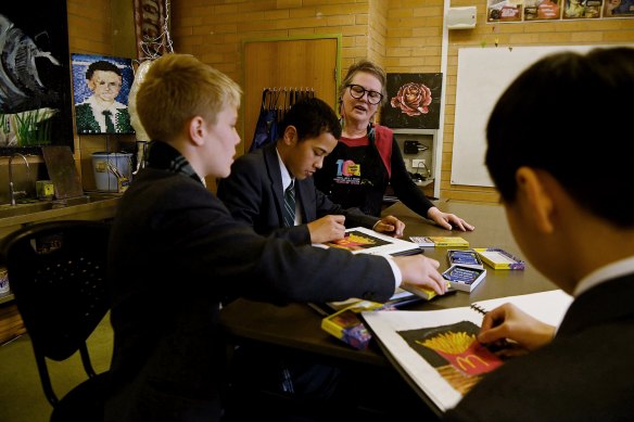 Nicole DeLosa with students at Trinity Grammar.