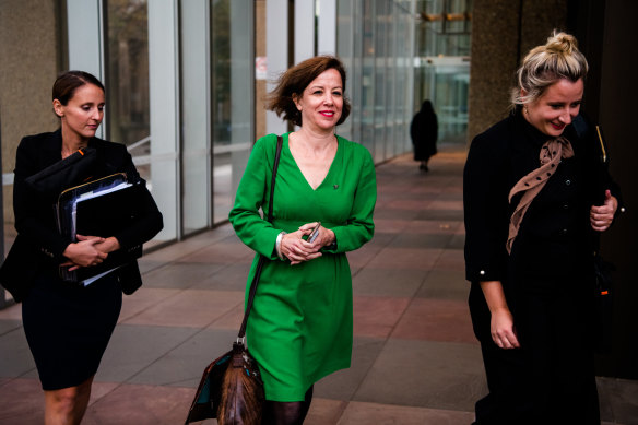 Jo Dyer, centre, outside the Federal Court in May. 