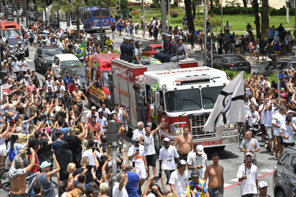 The remains of late Brazilian soccer great Pele are transported on a firetruck.