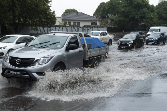 Northbound lanes on Concord Rd just before Ryde Bridge are flooded, causing traffic delays.