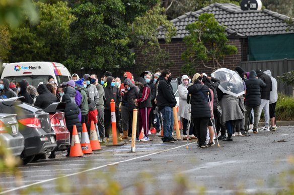 People line up for COVID-19 testing at Epping Memorial Community Hall in Melbourne’s northern suburbs.