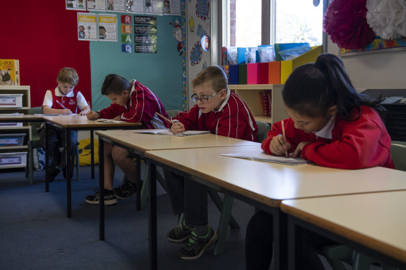 Emu Plains Public School year 3 students work at a distance during the phased return to school.