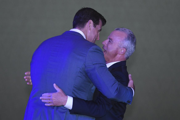 The Director of the Australian War Memorial Brendan Nelson (right) hugs Ben Roberts-Smith.