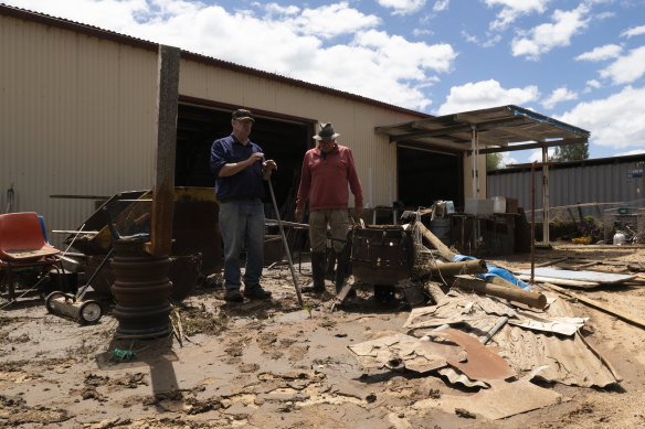 Eugowra locals Ron Hay (left) and Jack Barnes at the Eugowra Men’s Shed on Wednesday, after it was destroyed this week.