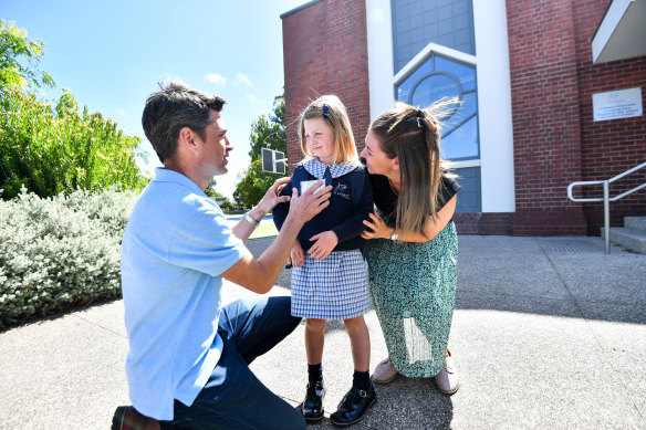 Sophie Butcher, who will start prep on Thursday at St Margaret’s Primary School, with her mother Catherine Tanner and father Sam Butcher.