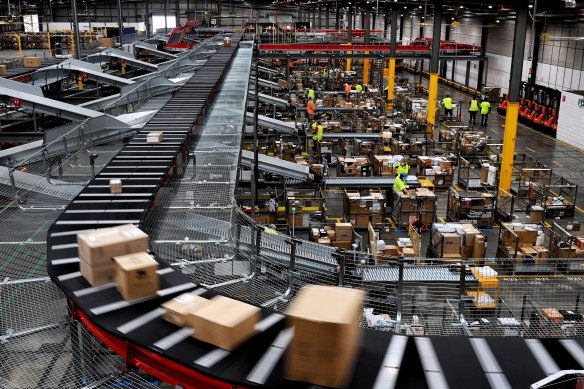 A busy Australia Post parcel distribution centre.