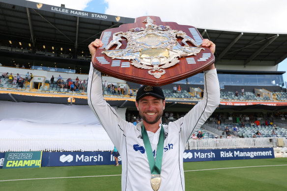 Western Australia captain Sam Whiteman holds the Sheffield Shield aloft after Sunday’s convincing win over Victoria.