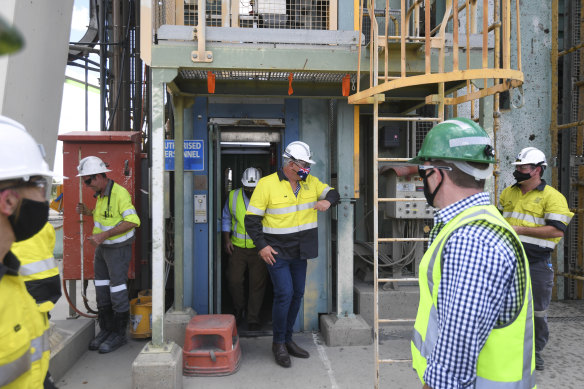 Prime Minister Scott Morrison thanks workers after emerging from a lift after being temporarily stuck inside due to a door failure during a visit to South32 Cannington Mine in McKinlay, Queensland on Wednesday.