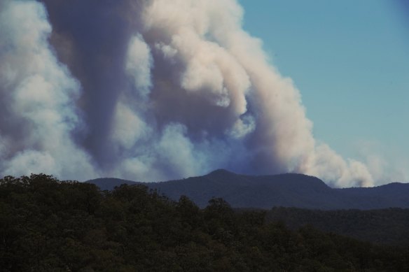 Putty RFS members watch the Gospers Mountain Fire move south east on Thursday.