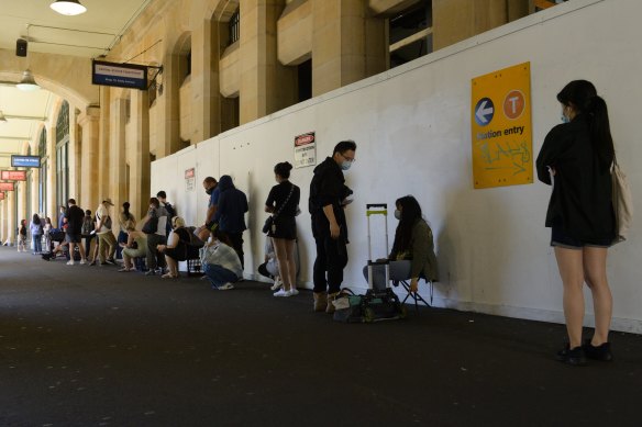People wait outside Central Station COVID-19 testing clinic.