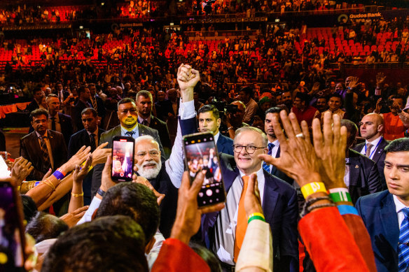 Indian Prime Minister Narendra Modi and his Australian counterpart Anthony Albanese exit the arena on Tuesday night. 