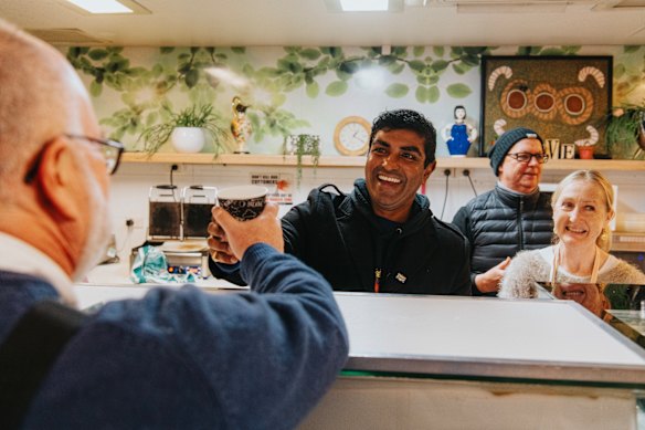 Jon Owen (centre), from the Wayside Chapel: “I say, don’t be miserable by yourself on Christmas Day. Come and be miserable with us. Come and enjoy life and light and community and joy.”