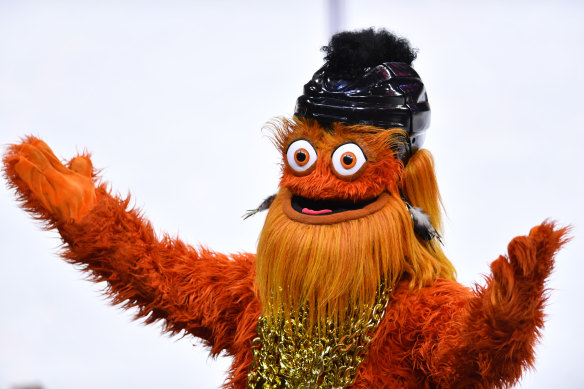 Philadelphia Flyers mascot Gritty, pictured here dressed up for '80s night, has been accused of punching a 13-year-old boy.