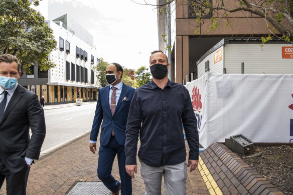 Mitchell Cole (right) leaves Parramatta Local Court after narrowly avoiding jail on Tuesday. 