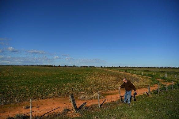 Mr Anderson on his land, with the site of the proposed plant in the background.