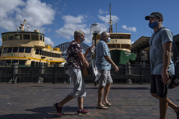 People wearing masks at Circular Quay in Sydney on Wednesday.