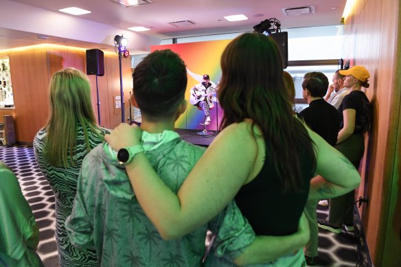 Partners Sam and Justine Goldon hold each other during an emotional performance from G Flip.