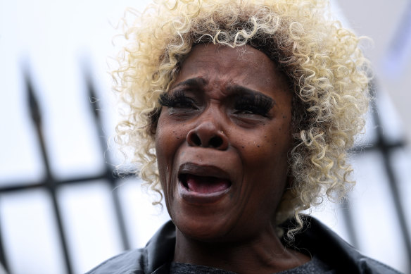 A demonstrator protesting the killing of Tyre Nichols gets emotional outside the Memphis Police Department Rideway Station on Sunday. 