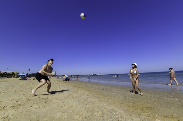 Melburnians enjoying the sunshine at St Kilda beach on Easter Saturday.