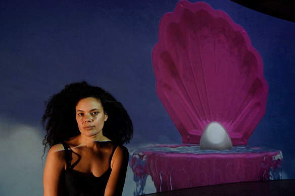 Artist Angela Tiatia in front of her video work “The Pearl” - part of the Matisse Alive exhibition.