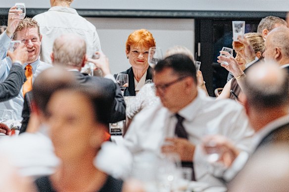 A toast is raised to the leader.