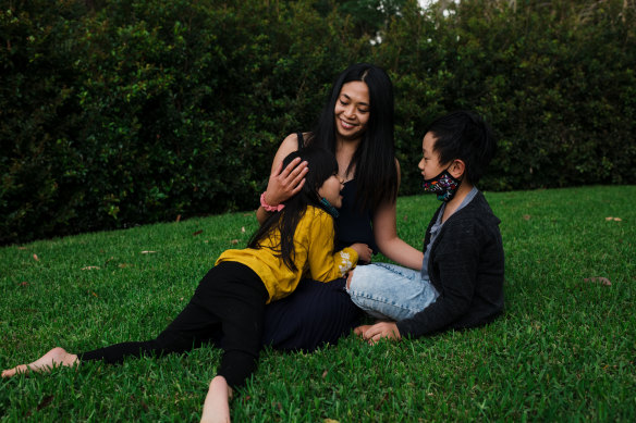 Tiara Relativo from Winston Hills with her children Madeleine and Harrison. She wants them to wear masks when they return to school.