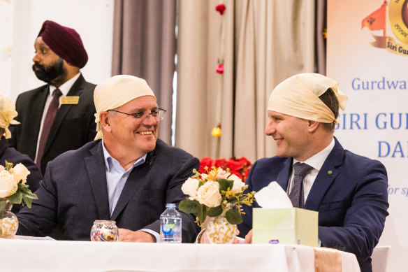 In happier times: former prime minister Scott Morrison and then immigration minister Alex Hawke at a Sikh community centre in Melbourne during the 2022 election campaign.