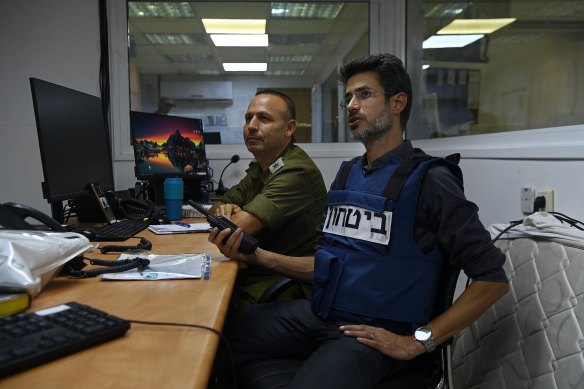 The mayor of Kiryat Shmona in northern Israel, Avichai Stern (right), in the city’s command centre. Kiryat Shmona is four kilometres from the Lebanon border. 