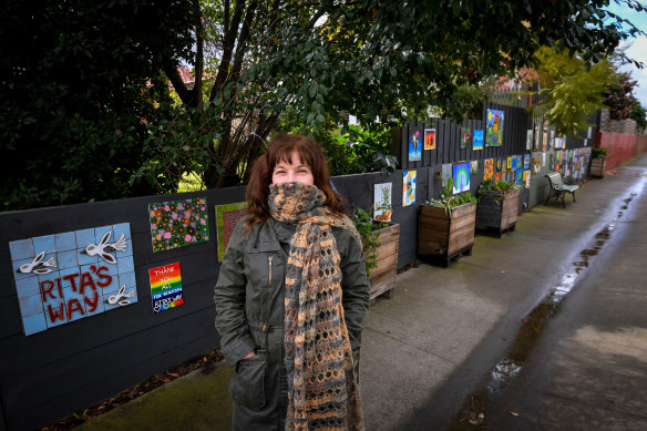 Artist Rita Santucci with some of the community arts at a laneway in Carnegie named Rita's Way by locals.