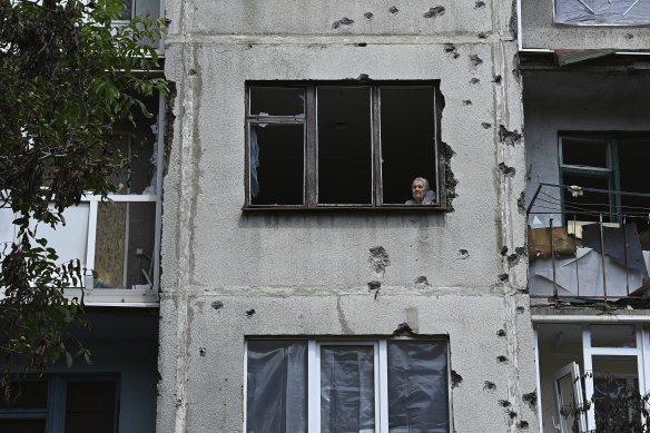 This apartment was destroyed by a missile strike but Lidia Svistunova sits here on a warm day  because it has the best view. 