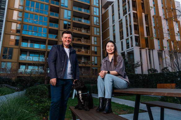 Thomas Pospieszny, with dog Joshie, and Nancy Chen are residents of Mirvac’s build-to-rent apartment complex at Sydney Olympic Park.