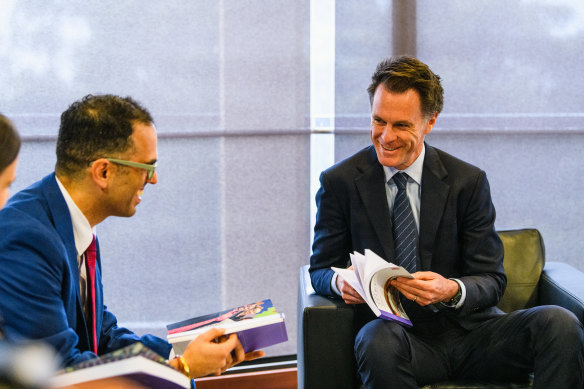 Treasurer Daniel Mookhey and Premier Chris Minns with copies of this year’s NSW Budget, which had housing supply at the centre of it.