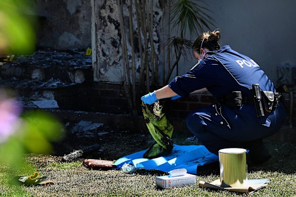 Police at the Guildford West property after the attack.