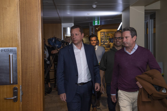 Daniel Mookhey, second from right, arrives at a caucus meeting in June 2021.