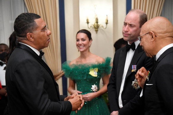 Jamaican Prime Minister Andrew Holness (left); Catherine, the Duchess of Cambridge; Prince William; and Governor-General of Jamaica Patrick Allen speak during a dinner at King’s House in Kingston on Wednesday.