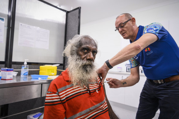 Christopher Frith, of the Binjari community, receives his first dose of the AstraZeneca vaccine.