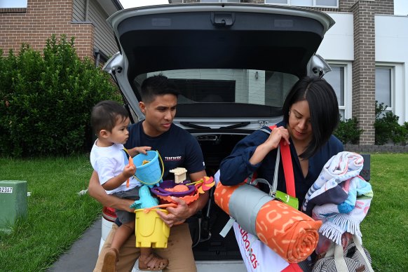 Donnie and Mei Velasco with Jonathan, 21 months, put a lot of planning and effort into going to the beach from Box Hill.