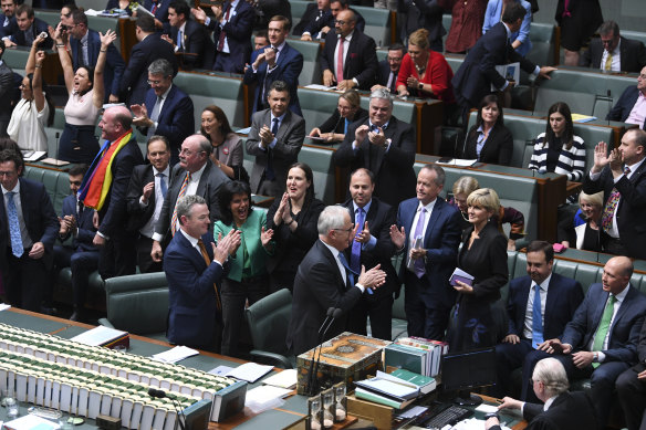 Turnbull and fellow Coalition MPs applaud as the House of Representatives votes to legalise same-sex marriage on December 7, 2017. 