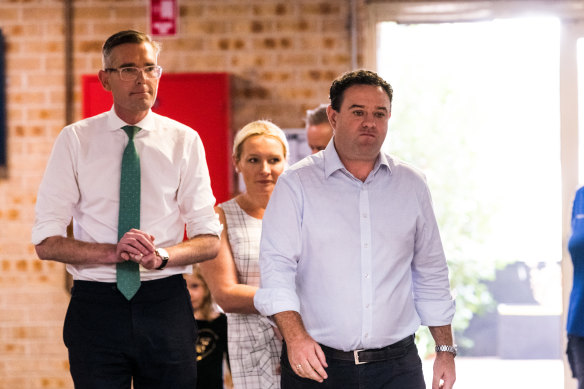 Premier Dominic Perrottet and Stuart Ayres on the campaign trail in Penrith on Friday.