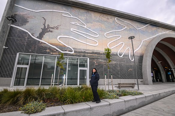 Station master Christine Rodrigues outside Arden station, adorned with Abdul Abdullah’s artwork Come Together. 