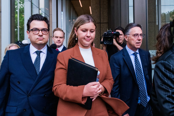 Brittany Higgins outside the Federal Court in Sydney last November, with partner David Sharaz (left) and lawyer Leon Zwier.