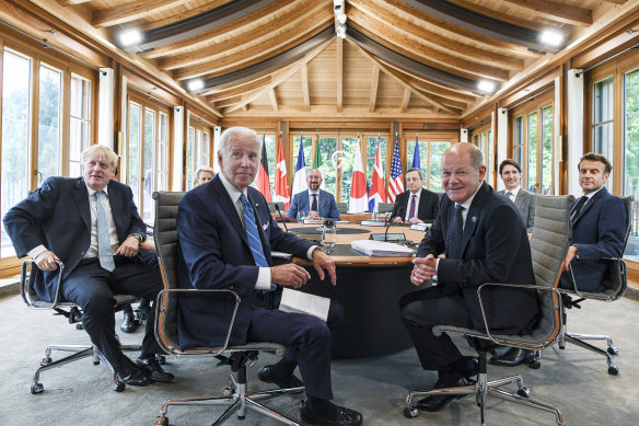 British Prime Minister Boris Johnson (left) mocked Russian President Vladimir Putin as the G7 leaders sat down to meet on Sunday. Also pictured 
are (left to right) European Commission President Ursula von der Leyen, US President Joe Biden, European Council President Charles Michel, Italian Prime Minister Mario Draghi,  German Chancellor Olaf Scholz, Canadian Prime Minister Justin Trudeau and French President Emmanuel Macron.