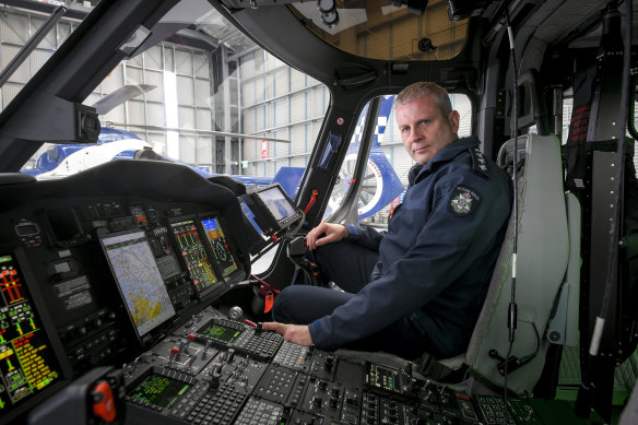 Victoria Police air wing Inspector Craig Shepherd in the new helicopter. 