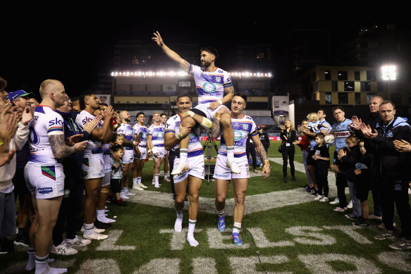 Shaun Johnson is carried off the field after playing his final NRL match.